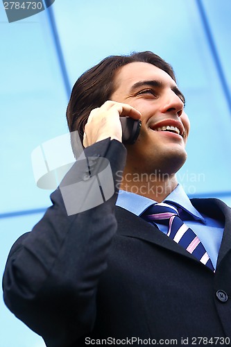 Image of businessman speaking on the telephone