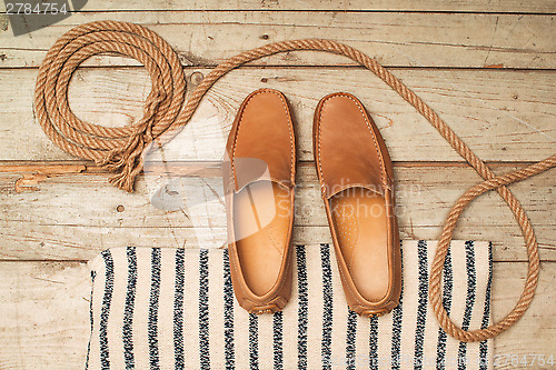 Image of Men's Loafer Shoe on old wood