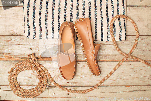 Image of Men's Loafer Shoe on old wood