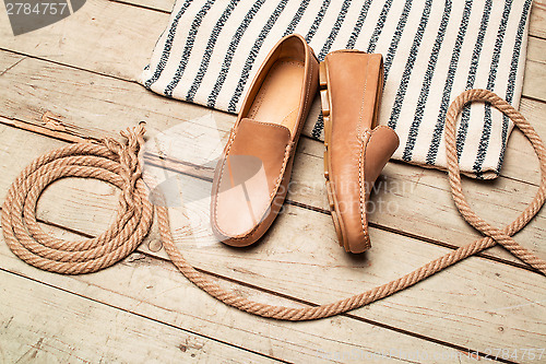 Image of Men's Loafer Shoe on old wood