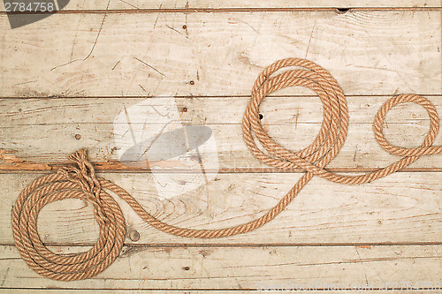 Image of Ropes on a wooden background