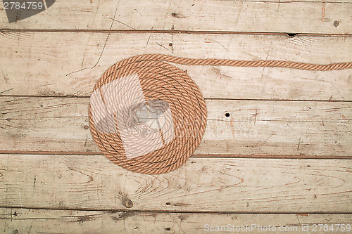 Image of Ropes on a wooden background