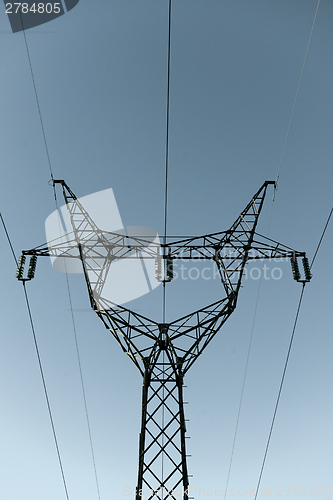 Image of High Voltage Post against blue sky