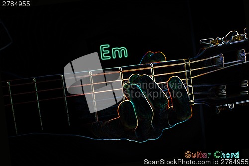 Image of Guitar chord on a dark background