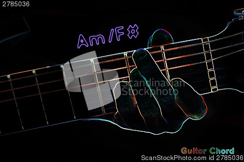 Image of Guitar chord on a dark background