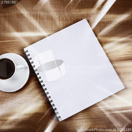 Image of White cup and white page