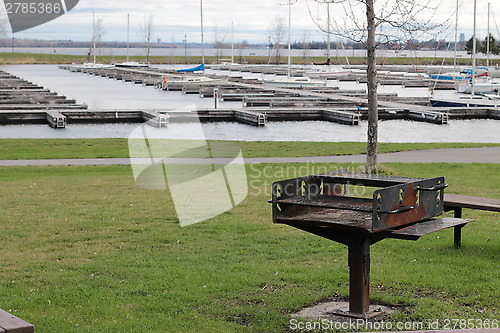 Image of Barbecue with Boat slips in the background