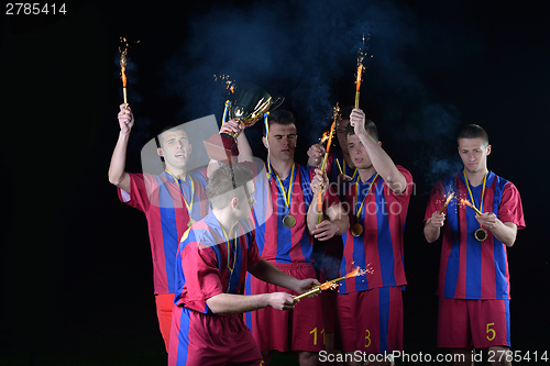 Image of soccer players celebrating victory