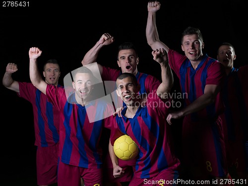 Image of soccer players celebrating victory