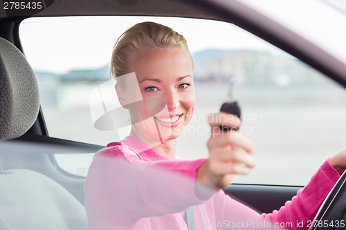 Image of Woman driver showing car keys.