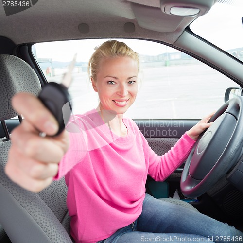 Image of Woman driver showing car keys.