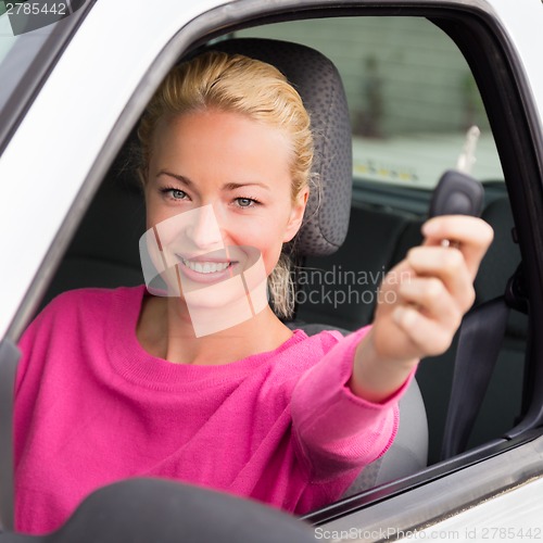 Image of Woman driver showing car keys.