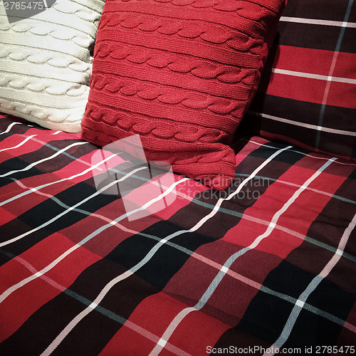 Image of Checked bed clothing and cushions