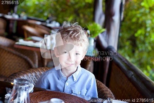 Image of boy in cafe