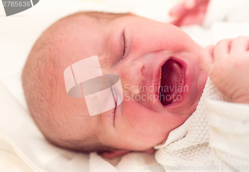 Image of crying newborn baby in the hospital