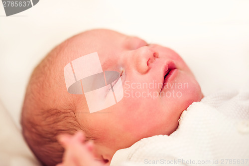 Image of sleeping newborn baby in the hospital