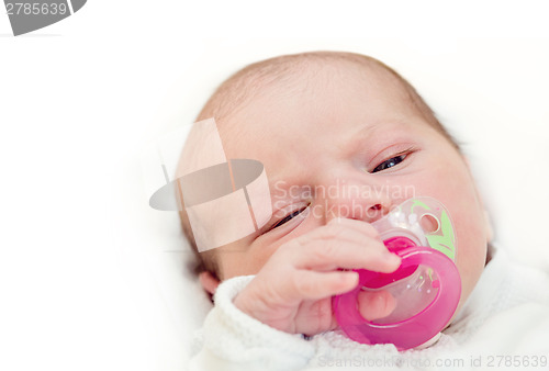 Image of adorable baby with pacifier