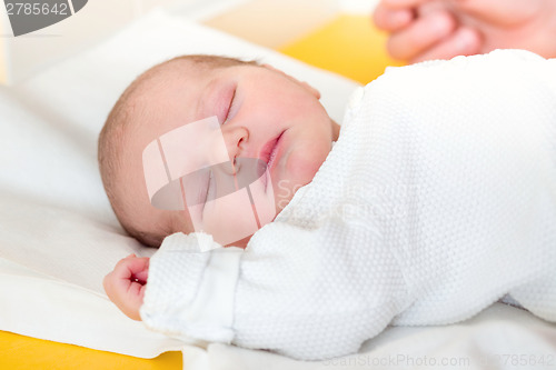 Image of sleeping newborn baby in the hospital