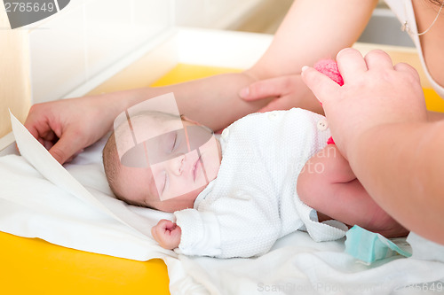 Image of sleeping newborn baby in the hospital