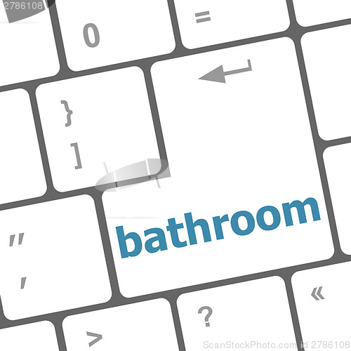 Image of bathroom word on keyboard key, notebook computer