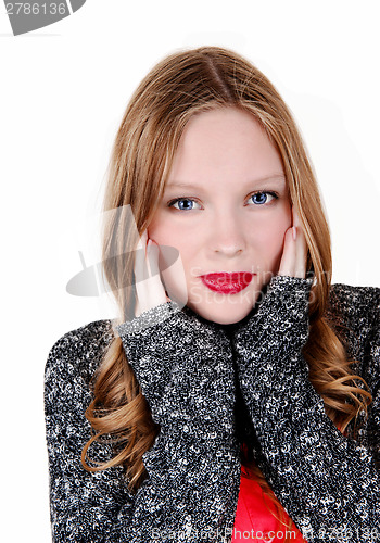 Image of Girl holding her face.