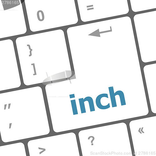 Image of inch button on keyboard - business concept