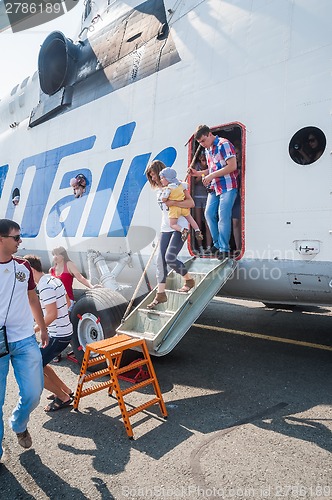 Image of People exploring the MI-26T helicopter