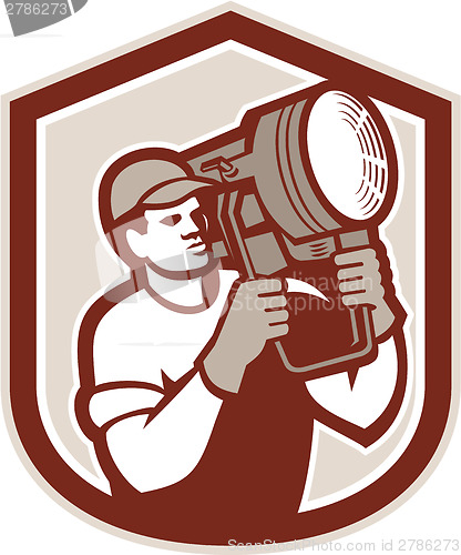 Image of Electrical Lighting Technician Carry Spotlight Shield