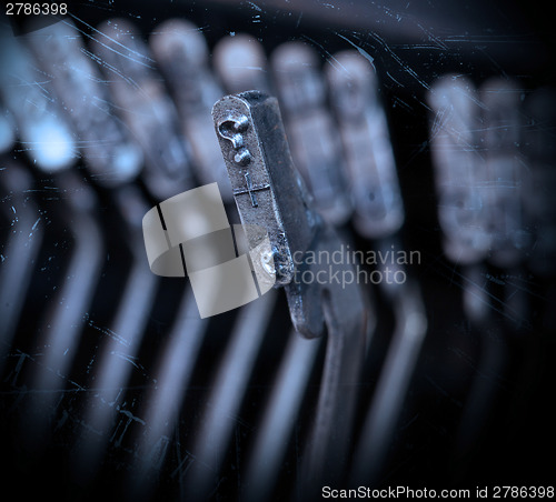 Image of Close-up of an old retro typewriter with paper