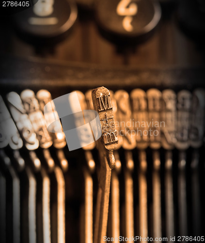 Image of Close-up of an old retro typewriter with paper