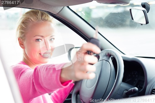 Image of Woman driver showing car keys.