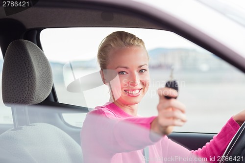 Image of Woman driver showing car keys.