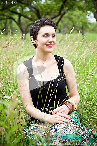 Image of girl resting on fresh spring grass 