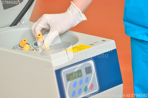 Image of blood tube in to centrifuge