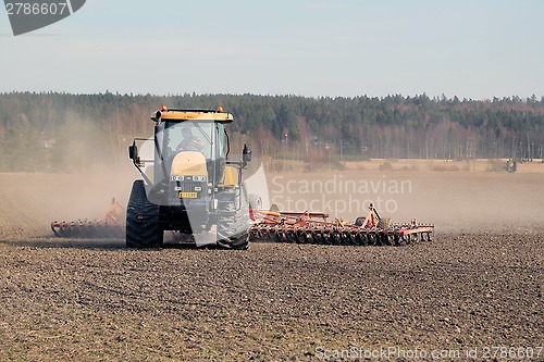 Image of Farmer Cultivating Field with Caterpillar Challenger Tractor and