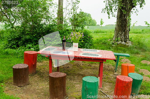 Image of garden wooden table bunch flowers colorful stumps 