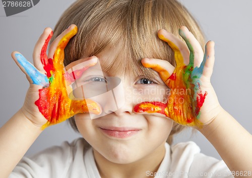Image of hands painted  in colorful paints