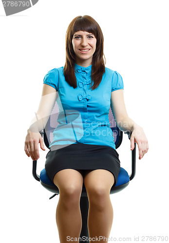 Image of Beautiful young girl sitting on an office chair. isolated on whi