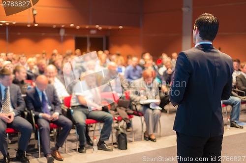 Image of Speaker at Business Conference and Presentation.