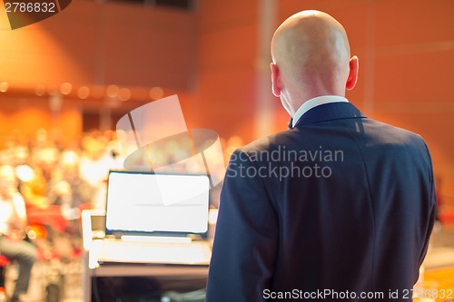 Image of Speaker at Business Conference and Presentation.