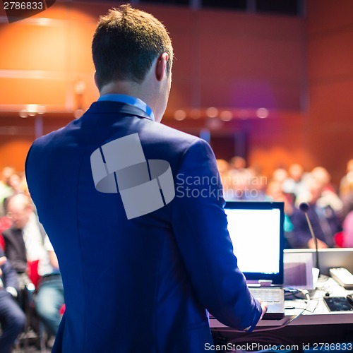 Image of Speaker at Business Conference and Presentation.