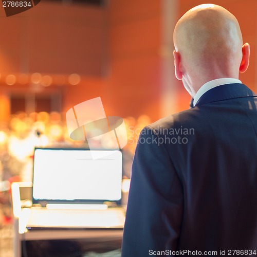 Image of Speaker at Business Conference and Presentation.