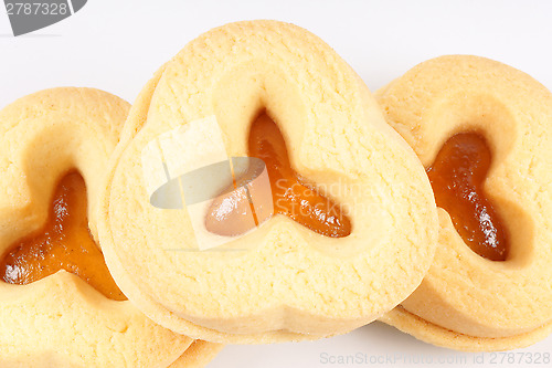 Image of shortcrust pastry biscuits with apricot jam