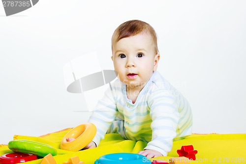 Image of Little baby boy with toys