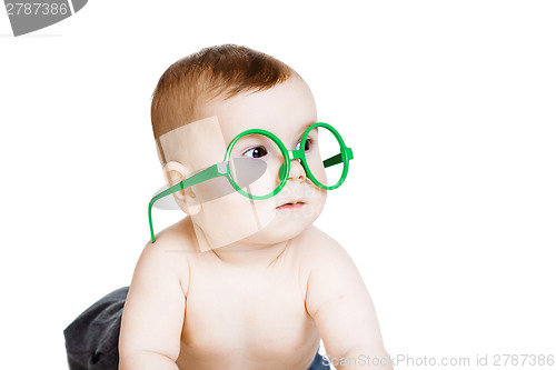 Image of Little baby boy in the big funny glasses. isolated on white back