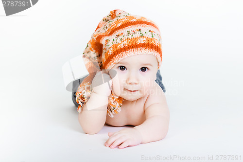 Image of Little baby boy in a knitted hat posing