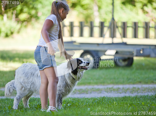 Image of Little girl with dog