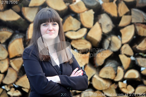 Image of Business woman with wood background