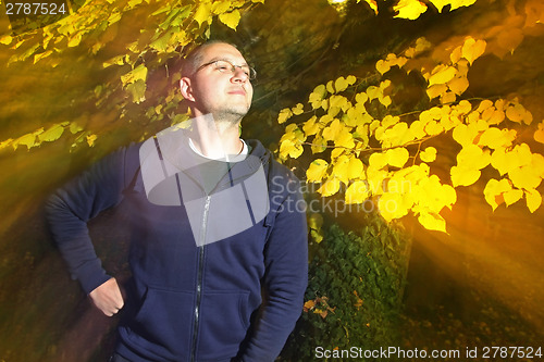 Image of Man in autumn park