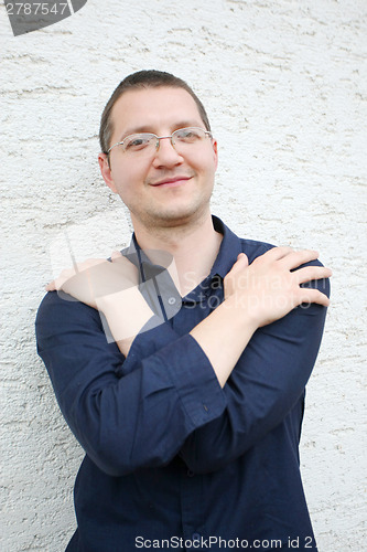 Image of Man posing with arms crossed
